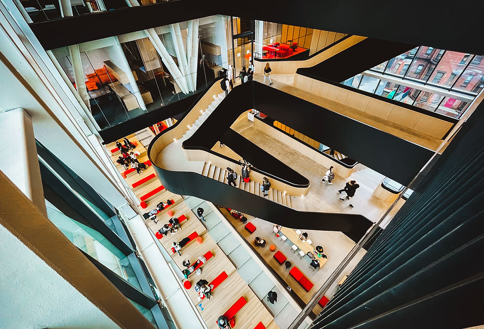A curved staircase connects multiple floors.