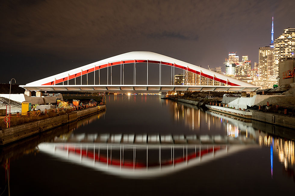 The Port Lands bridges are steel-tied, arch bridge structures that connect the newly-formed Villiers Island in Toronto, utilizing open steel plate shell elements curved in two directions.