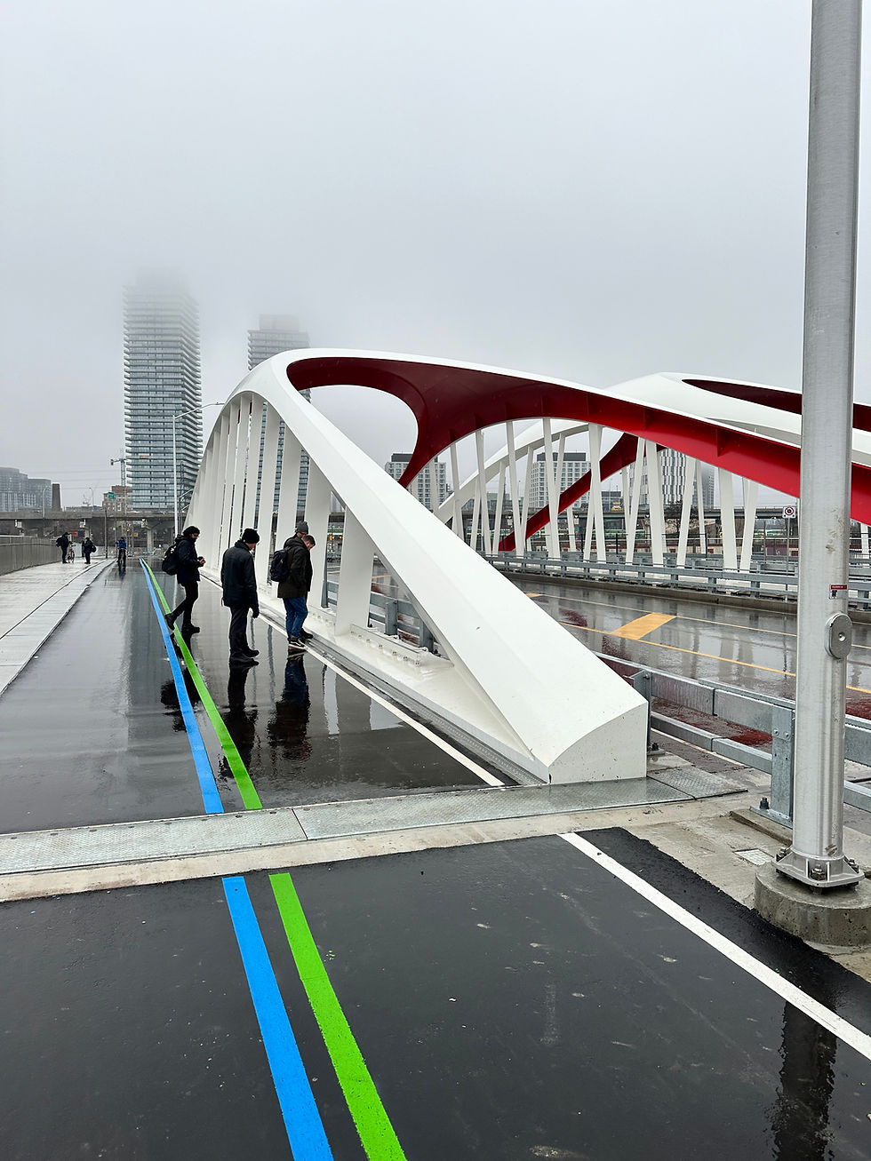 Team members from Entuitive and Grimshaw inspect their design work on the newly opened Cherry St. North Bridge (photo credit: Misha Vickar)