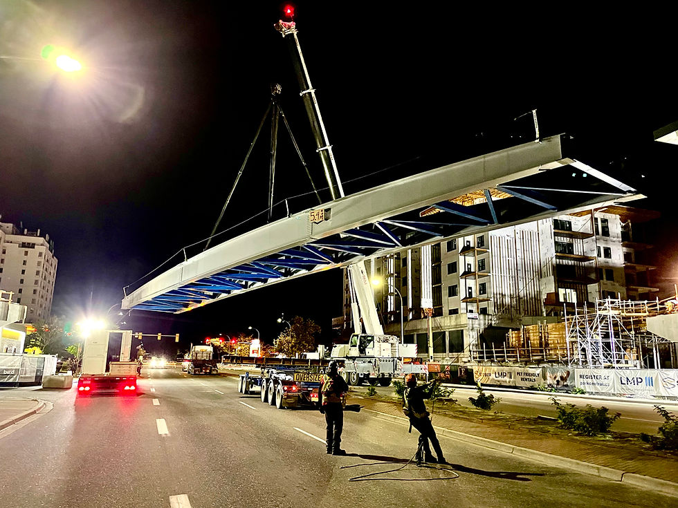 Bertram bridge lift during nighttime construction. 
